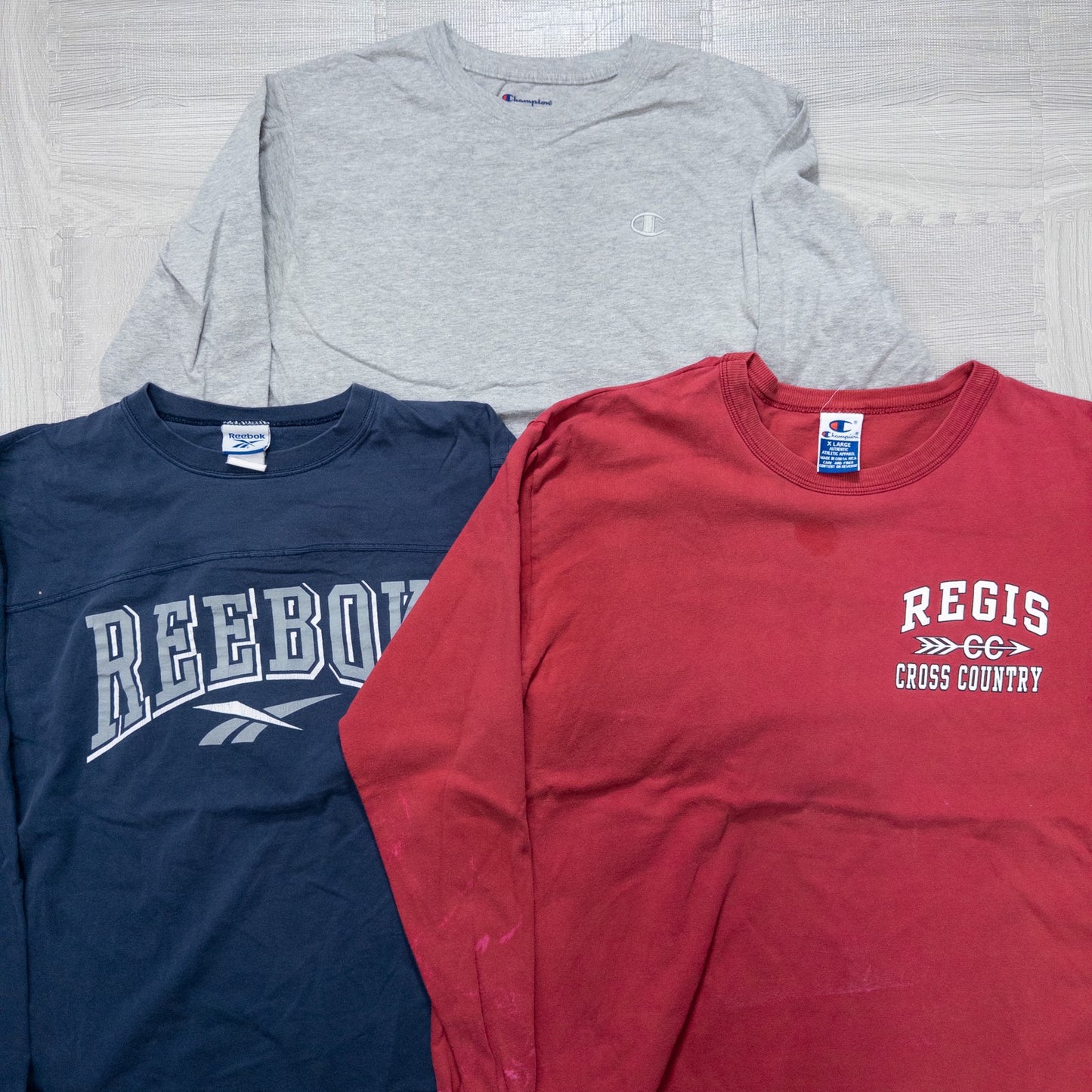 Used clothing wholesale, bulk sale, washed, mixed-brand long-sleeve T-shirts (12-pack, M-XXL) from Nike, Champion, and more.