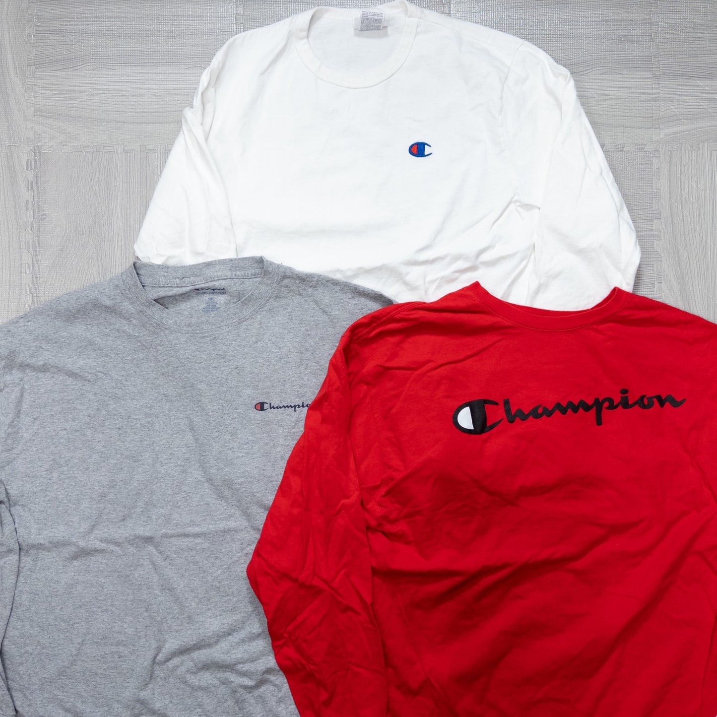 Used clothing wholesale, bulk sale, washed, mixed-brand long-sleeve T-shirts (12-pack, M-XXL) from Nike, Champion, and more.