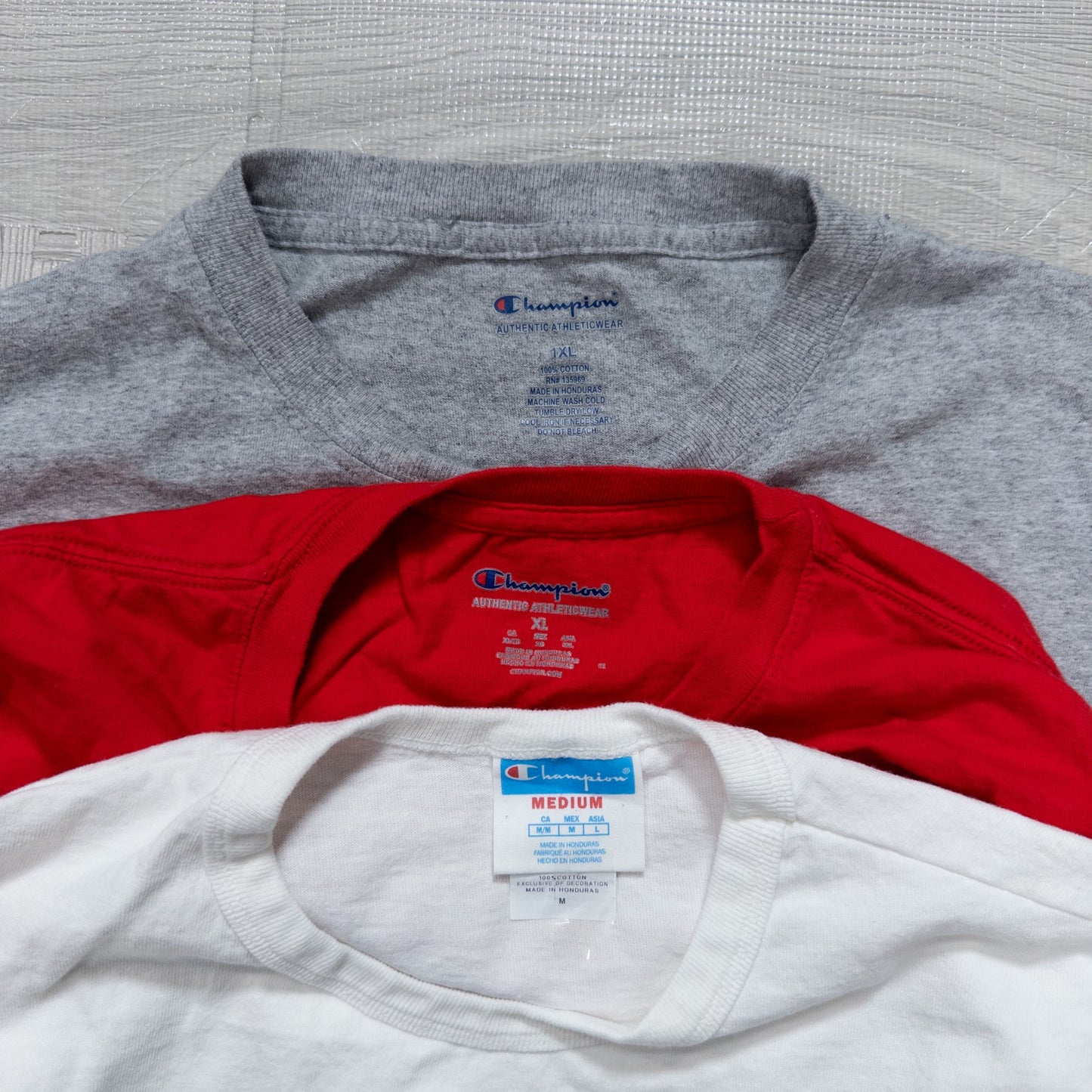 Used clothing wholesale, bulk sale, washed, mixed-brand long-sleeve T-shirts (12-pack, M-XXL) from Nike, Champion, and more.