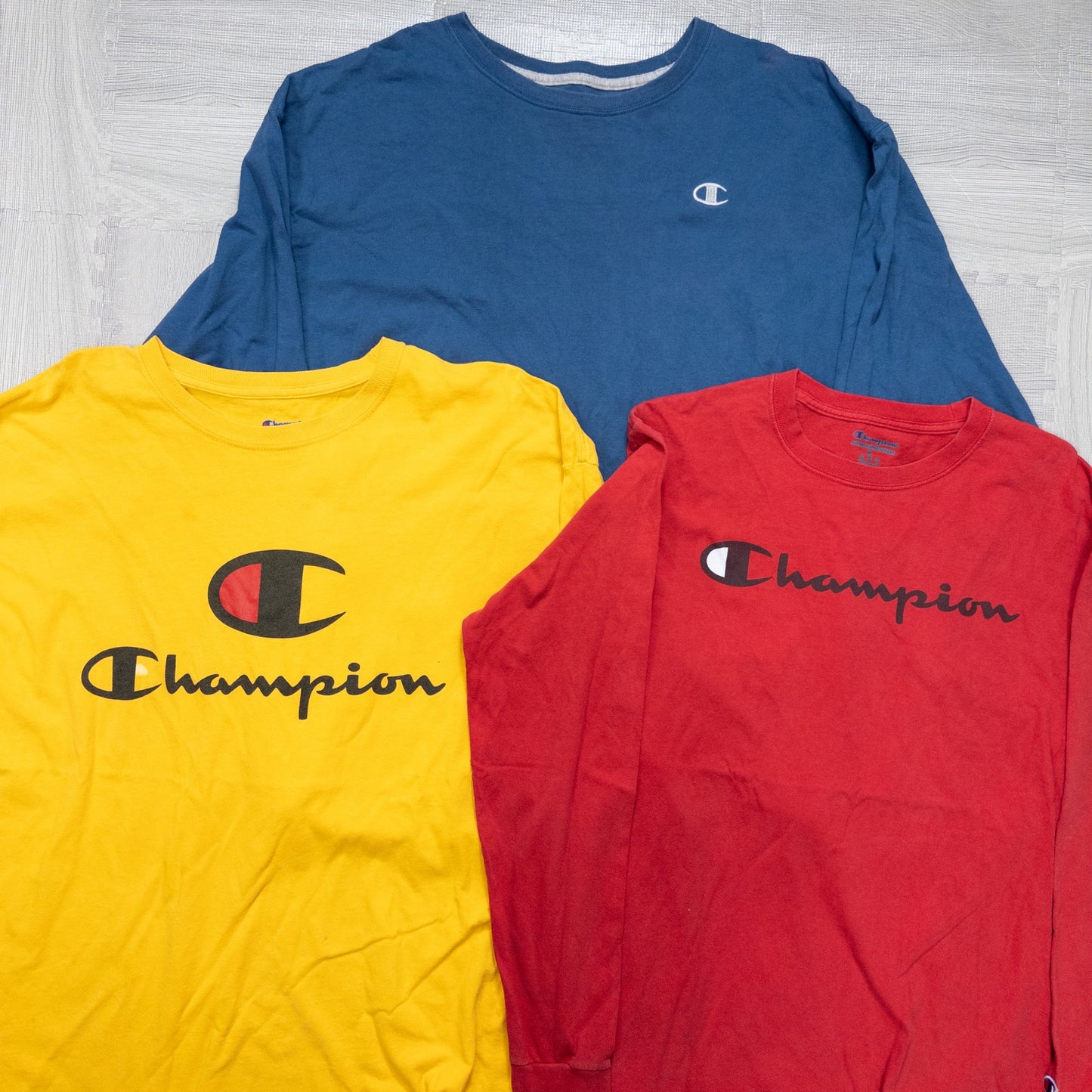 Used clothing wholesale, bulk sale, washed, mixed-brand long-sleeve T-shirts (12-pack, M-XXL) from Nike, Champion, and more.